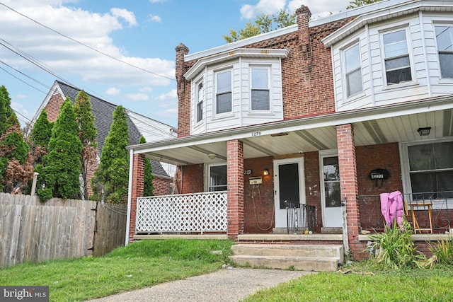 multi unit property featuring a porch