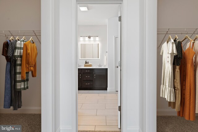 hallway featuring a sink