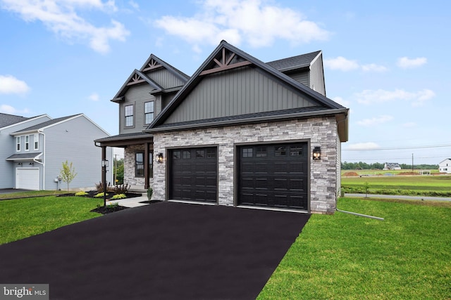 craftsman-style home featuring a front yard and a garage