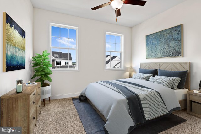 bedroom with a ceiling fan, carpet, and baseboards