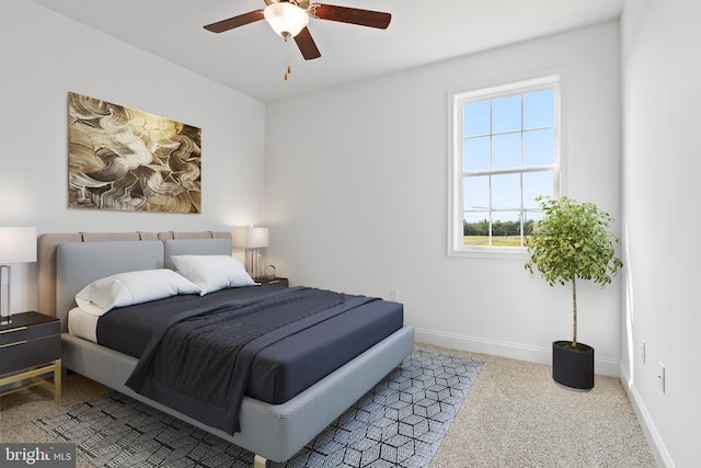 carpeted bedroom featuring baseboards and ceiling fan