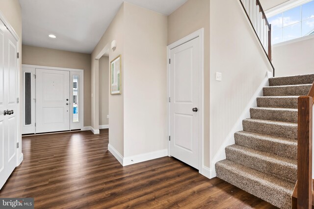 entryway featuring stairs, recessed lighting, dark wood-style floors, and baseboards