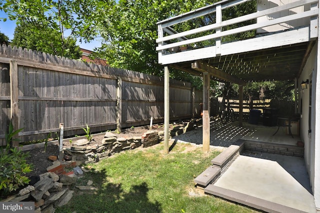 view of yard featuring a wooden deck