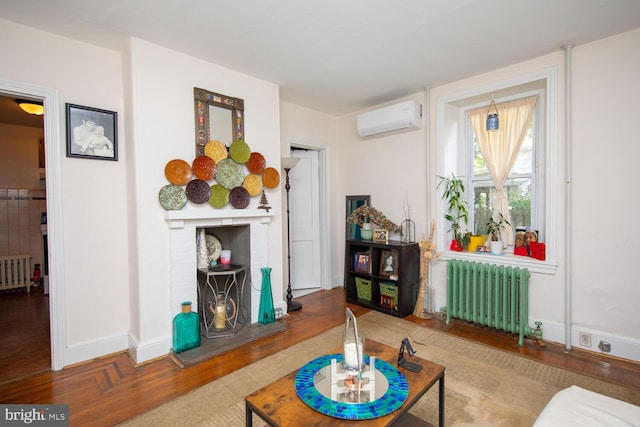 living room with wood-type flooring, a wall mounted air conditioner, and radiator heating unit