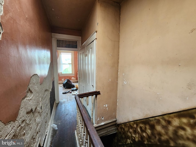 hallway with dark hardwood / wood-style floors