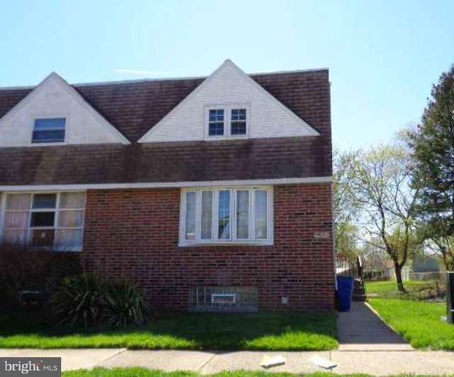 view of property exterior with a yard