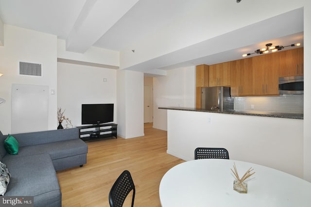 living room with light hardwood / wood-style flooring