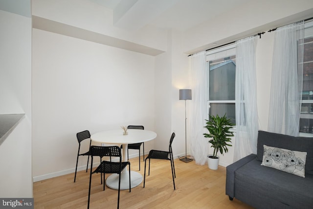 dining space with light hardwood / wood-style floors