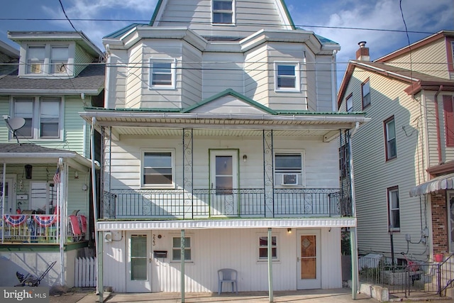 view of front of property with a balcony