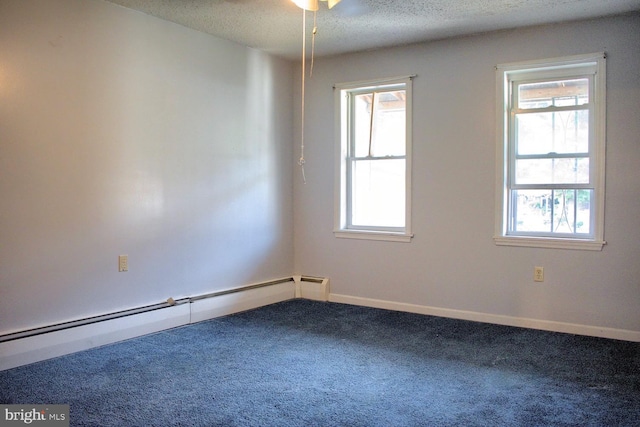 carpeted empty room with baseboard heating, a textured ceiling, and ceiling fan