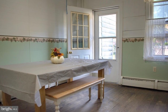 dining room with pool table, a baseboard heating unit, and dark hardwood / wood-style flooring