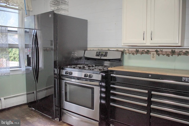 kitchen with white cabinetry, plenty of natural light, dark hardwood / wood-style floors, and gas stove