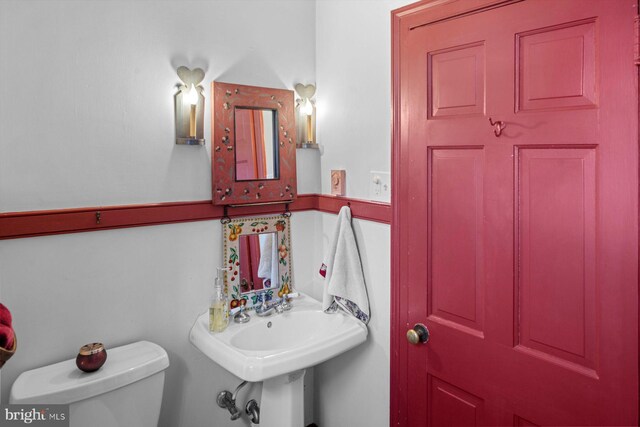 bathroom with toilet and sink