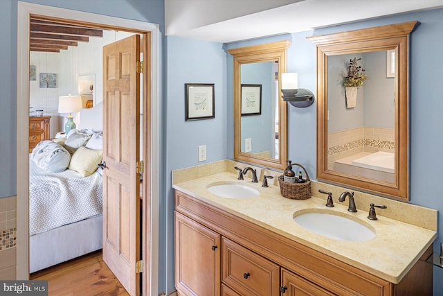 bathroom with vanity and hardwood / wood-style floors