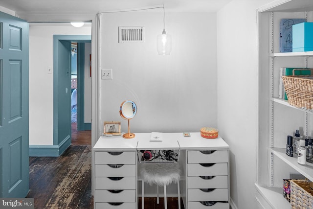 office space with dark wood-type flooring