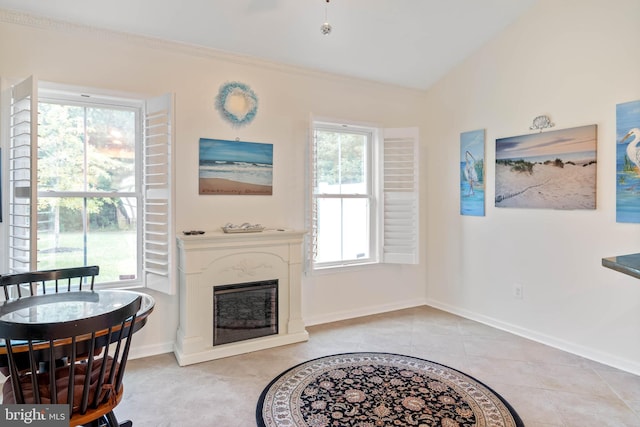 living room with lofted ceiling and light tile patterned floors