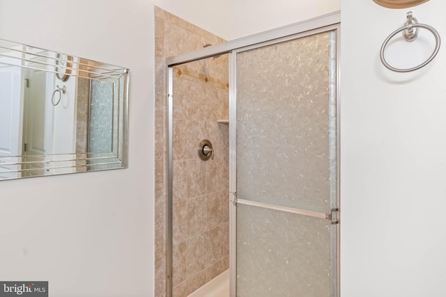 bathroom featuring an enclosed shower