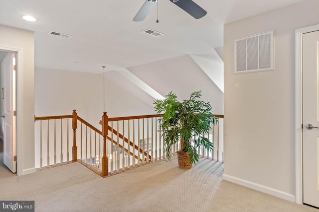 hallway with light carpet