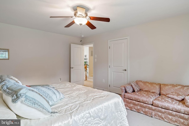 carpeted bedroom featuring ceiling fan