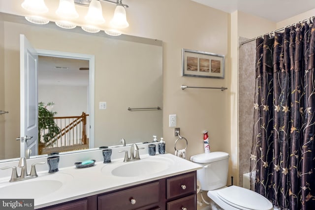 full bathroom featuring vanity, toilet, and shower / bath combination with curtain