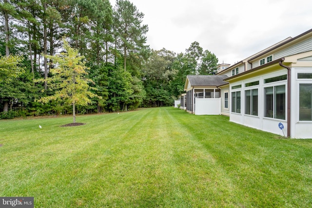 view of yard featuring a sunroom