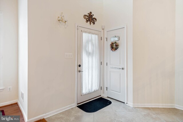 tiled entryway with a wealth of natural light