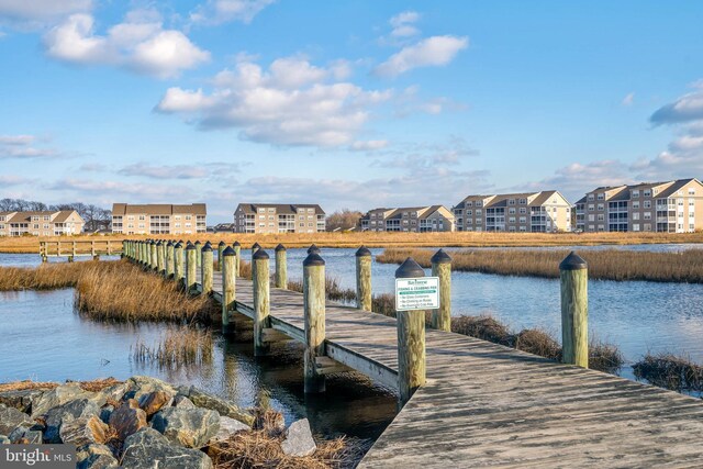 dock area featuring a water view