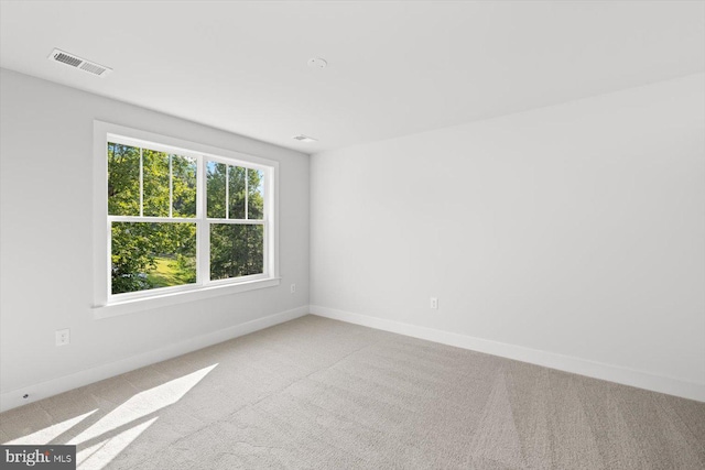 empty room featuring light carpet