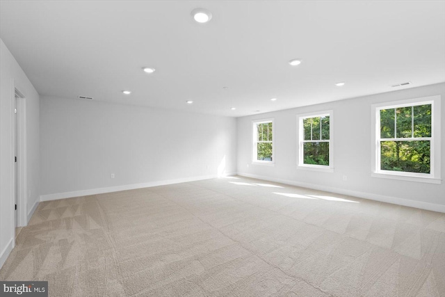 empty room featuring light colored carpet