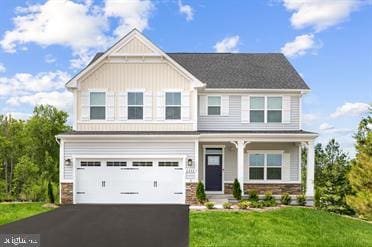 view of front facade with a front lawn and a garage