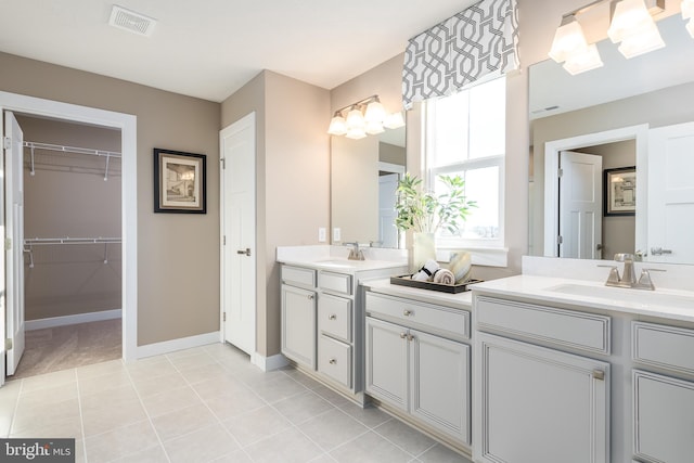 bathroom with tile patterned flooring and vanity