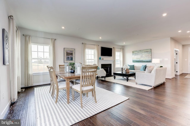 dining space with dark wood-type flooring