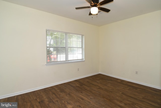 empty room featuring ceiling fan and dark hardwood / wood-style floors