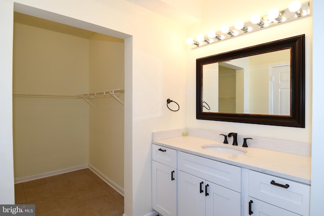 bathroom with tile patterned flooring and vanity