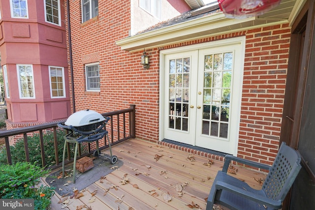 wooden deck featuring french doors and grilling area