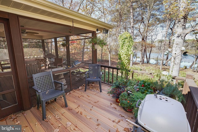 wooden deck featuring a water view