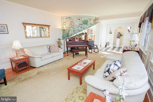 living room featuring hardwood / wood-style flooring and crown molding