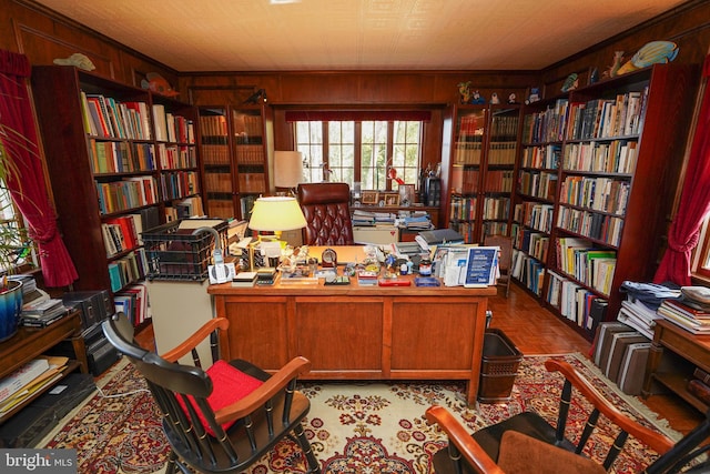 home office featuring wood walls