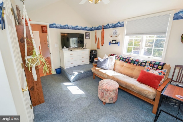 living room featuring ceiling fan, vaulted ceiling, and carpet floors