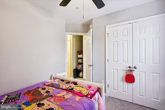 bedroom with ceiling fan, a closet, and carpet