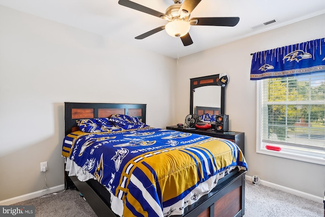 bedroom with ceiling fan and carpet flooring