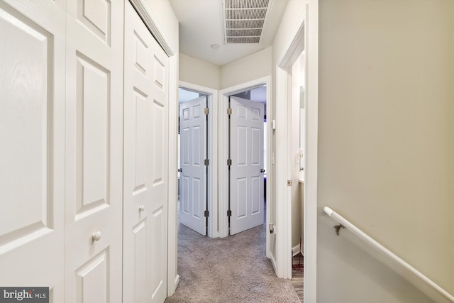 corridor with light carpet