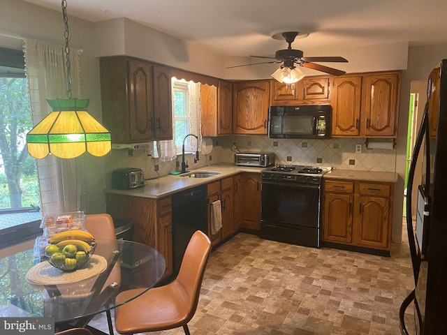 kitchen with ceiling fan, sink, tasteful backsplash, and black appliances