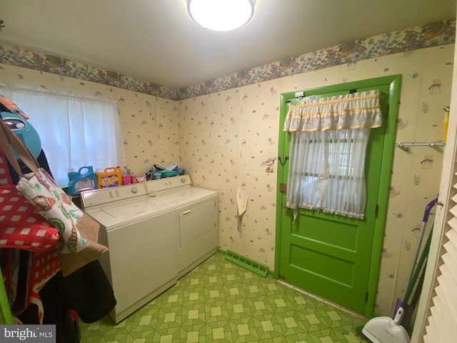 laundry area featuring washing machine and clothes dryer