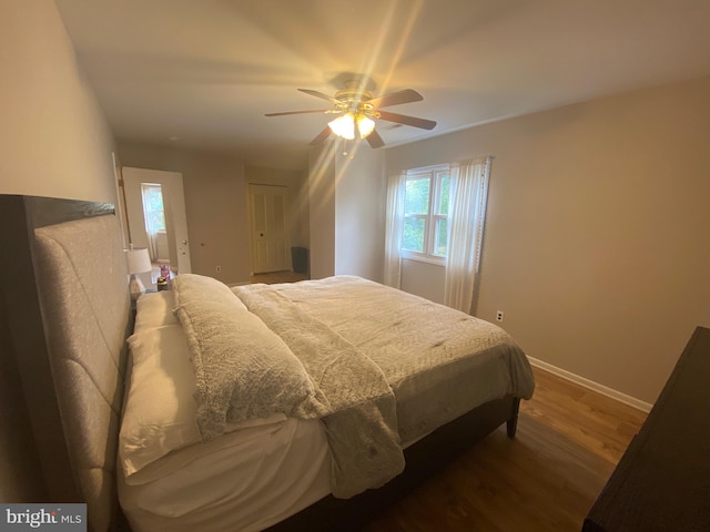 bedroom with ceiling fan and hardwood / wood-style floors