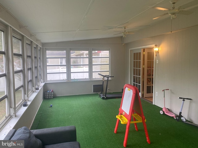 interior space featuring ceiling fan, plenty of natural light, and vaulted ceiling