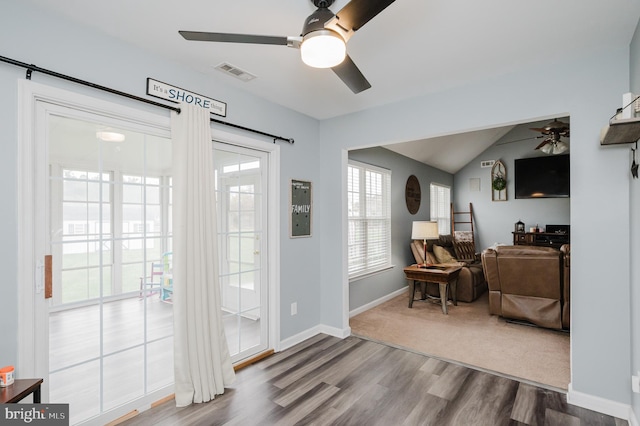 entrance foyer featuring lofted ceiling and hardwood / wood-style flooring