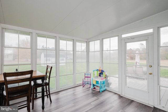 sunroom / solarium with vaulted ceiling