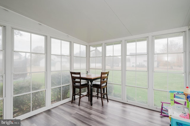 sunroom / solarium with lofted ceiling