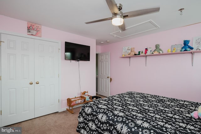 carpeted bedroom featuring a closet and ceiling fan